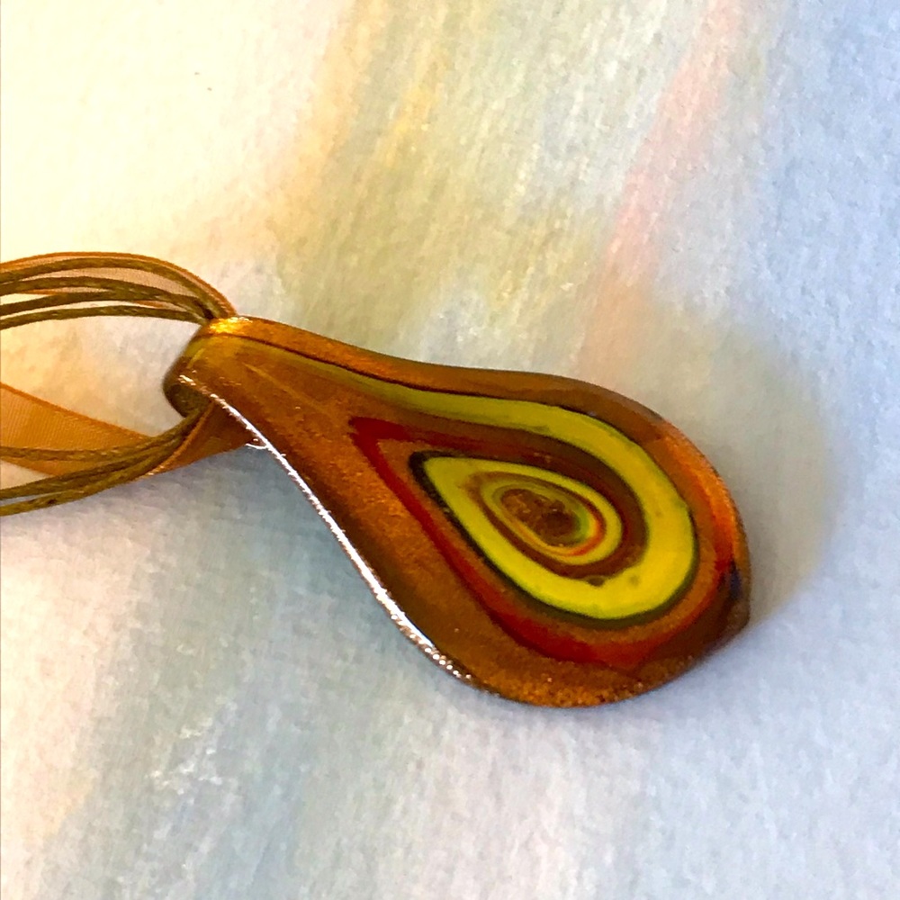 Glass necklace pendant with multiple colors. Very pretty!